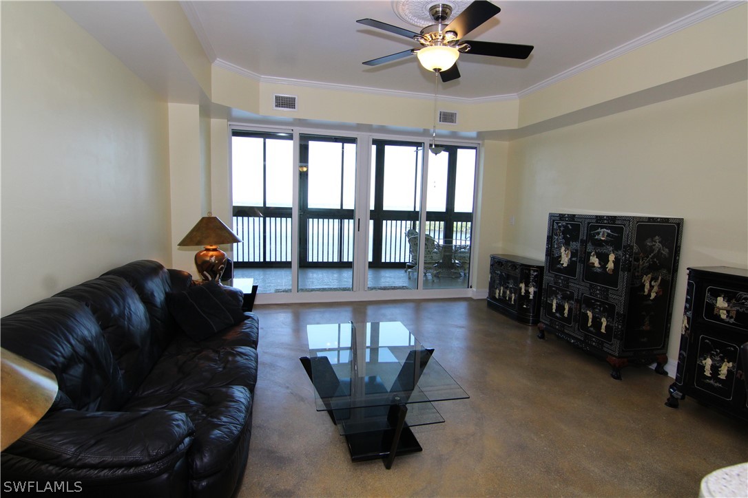 2797 First Street, Unit 804 Fort Myers, FL 33916 - Photo 14 of 34 a living room with furniture and a chandelier