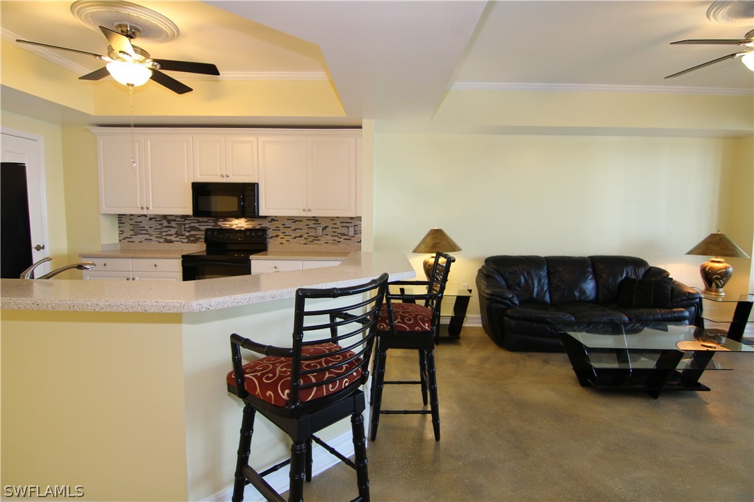 2797 First Street, Unit 804 Fort Myers, FL 33916 - Photo 15 of 34 a living room with furniture and a flat screen tv