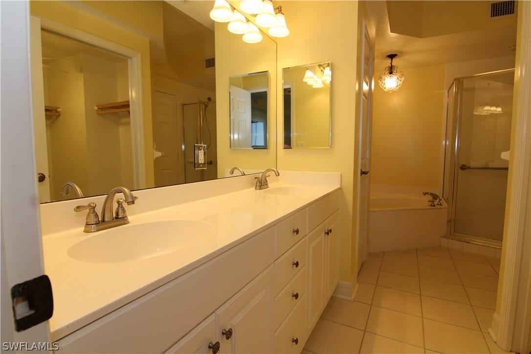 2797 First Street, Unit 804 Fort Myers, FL 33916 - Photo 21 of 34 a bathroom with a double vanity sink mirror and shower