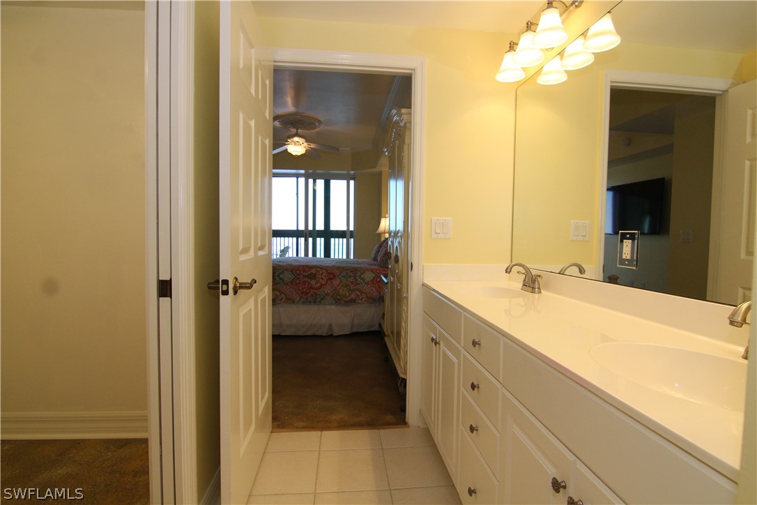 2797 First Street, Unit 804 Fort Myers, FL 33916 - Photo 22 of 34 a spacious bathroom with a shower sink and mirror