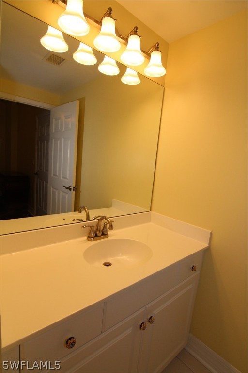2797 First Street, Unit 804 Fort Myers, FL 33916 - Photo 32 of 34 a bathroom with a sink and a mirror