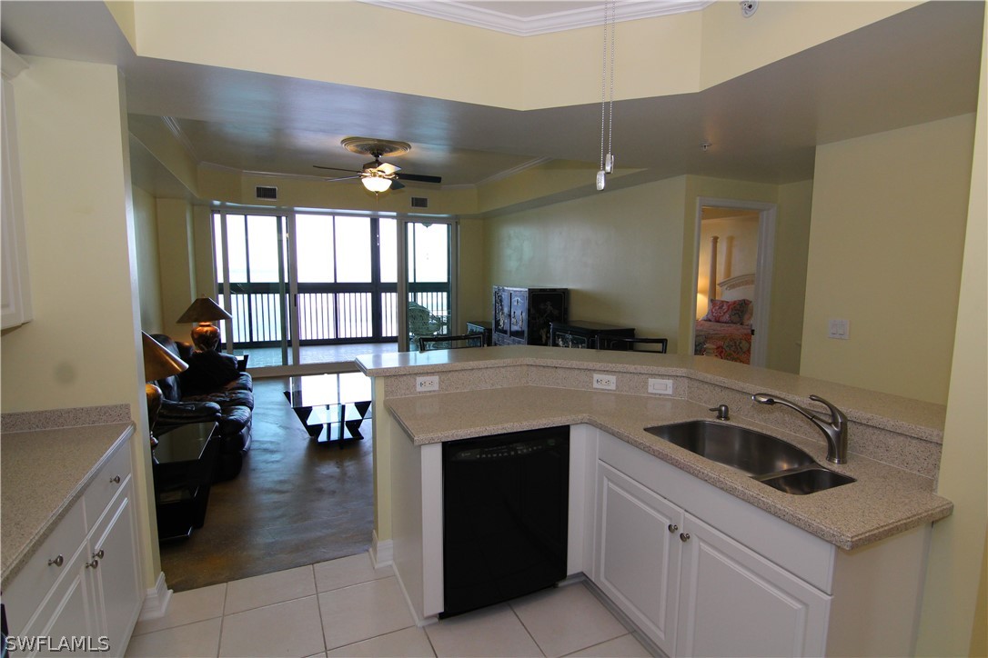 2797 First Street, Unit 804 Fort Myers, FL 33916 - Photo 33 of 34 a kitchen with a stove a sink and a refrigerator