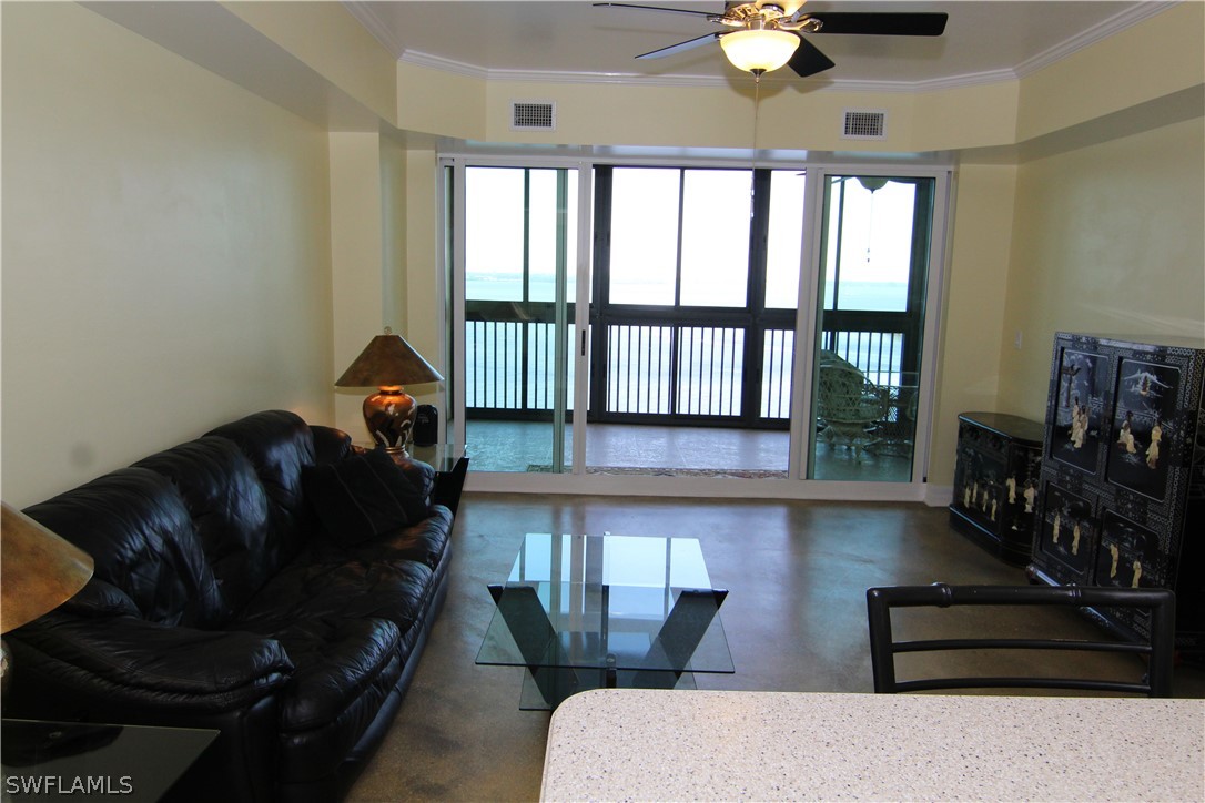 2797 First Street, Unit 804 Fort Myers, FL 33916 - Photo 34 of 34 a living room with furniture and a floor to ceiling window