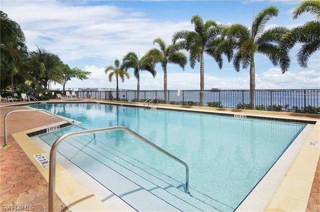 2797 First Street, Unit 804 Fort Myers, FL 33916 - Photo 6 of 34 a view of a swimming pool with a table and chairs