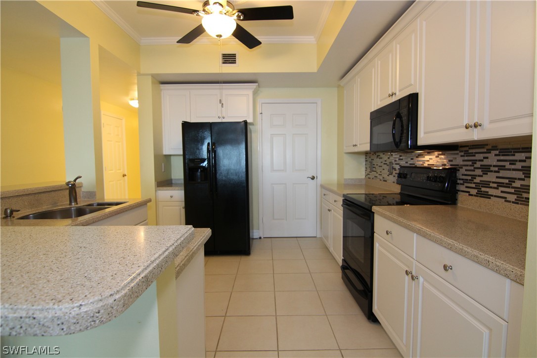 2797 First Street, Unit 804 Fort Myers, FL 33916 - Photo 10 of 34 a kitchen with a sink and cabinets