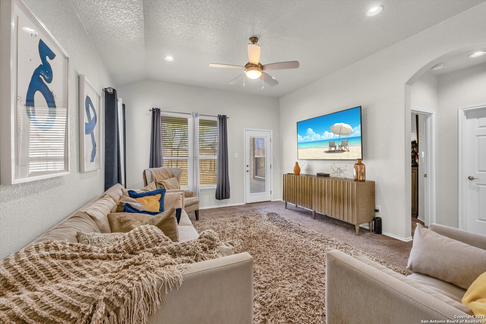 7235 Lunar Eclipse Converse, TX 78109 - Photo 12 of 29 a living room with furniture and a flat screen tv