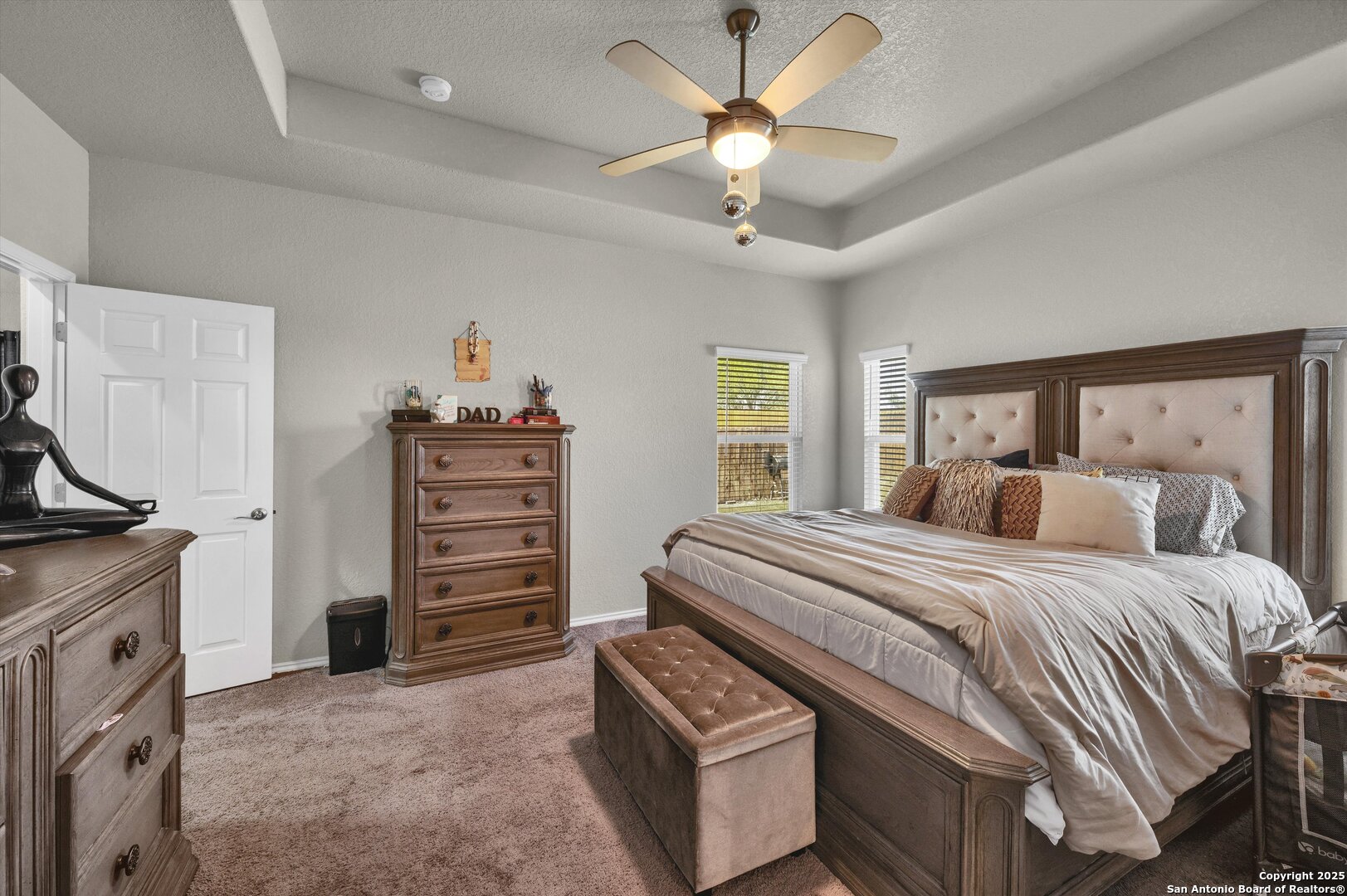 7235 Lunar Eclipse Converse, TX 78109 - Photo 15 of 29 a bedroom with a bed and a chandelier