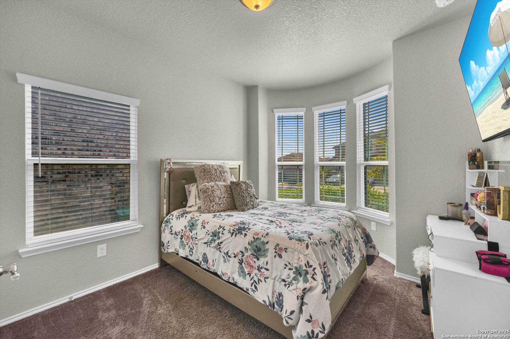 7235 Lunar Eclipse Converse, TX 78109 - Photo 19 of 29 a bedroom with a bed and a window
