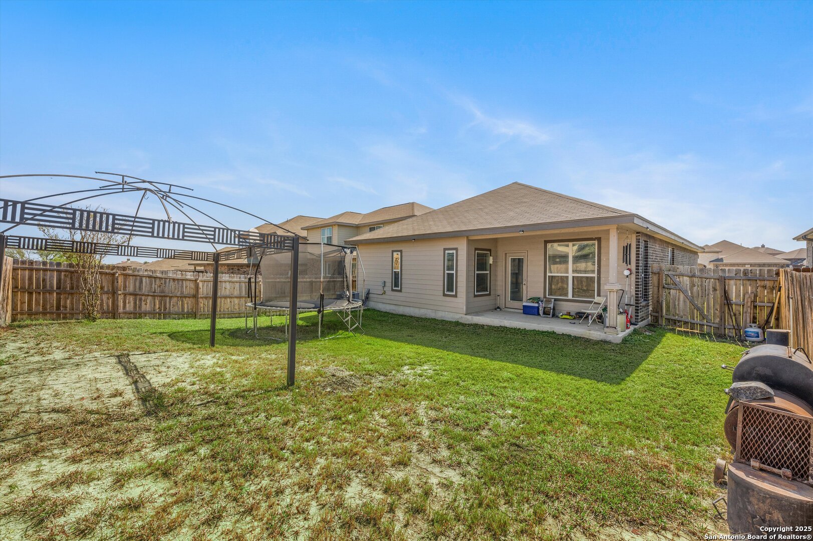 7235 Lunar Eclipse Converse, TX 78109 - Photo 24 of 29 a view of a house with a yard and sitting area