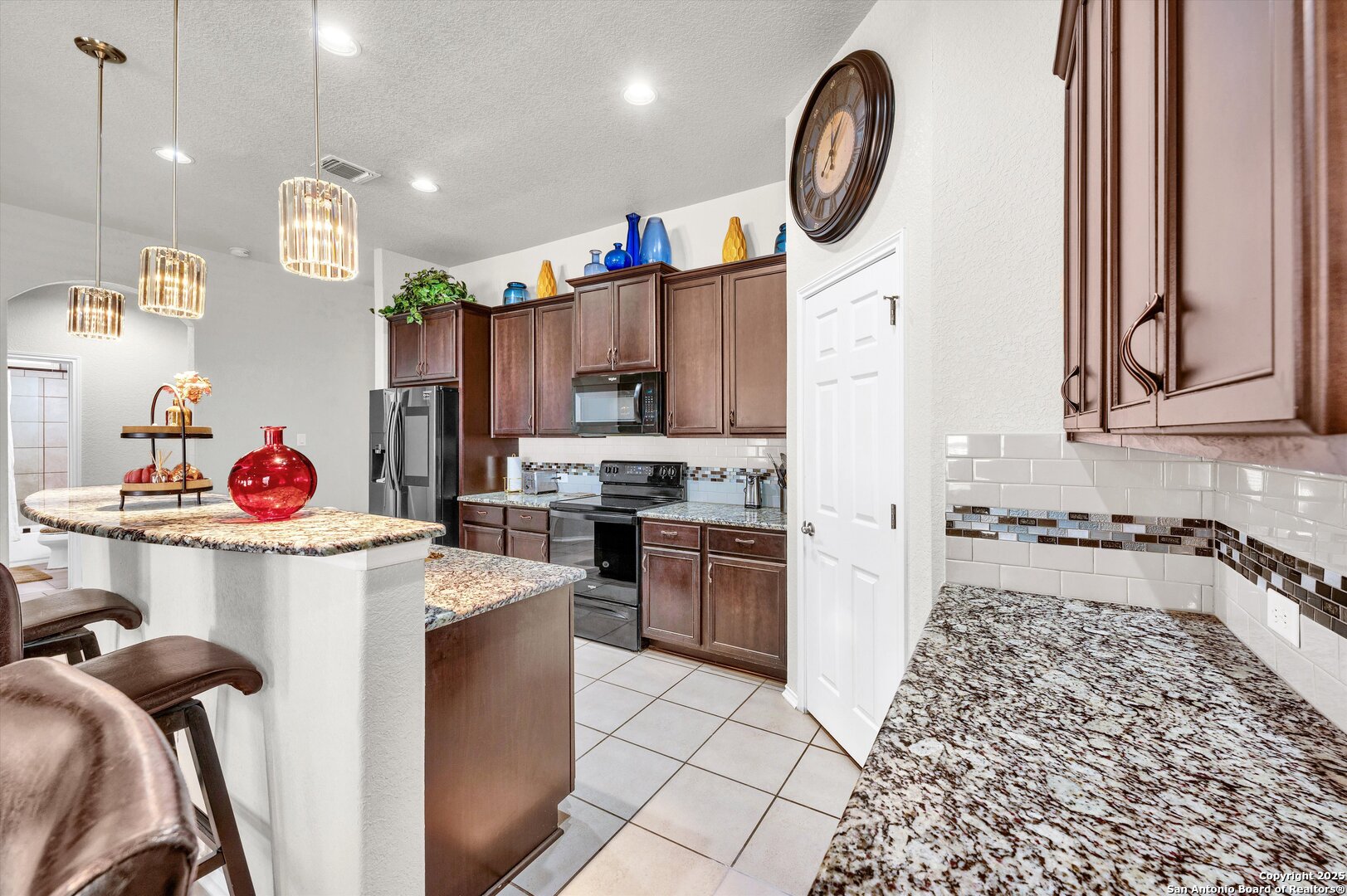 7235 Lunar Eclipse Converse, TX 78109 - Photo 7 of 29 a kitchen with a stove a refrigerator and a sink
