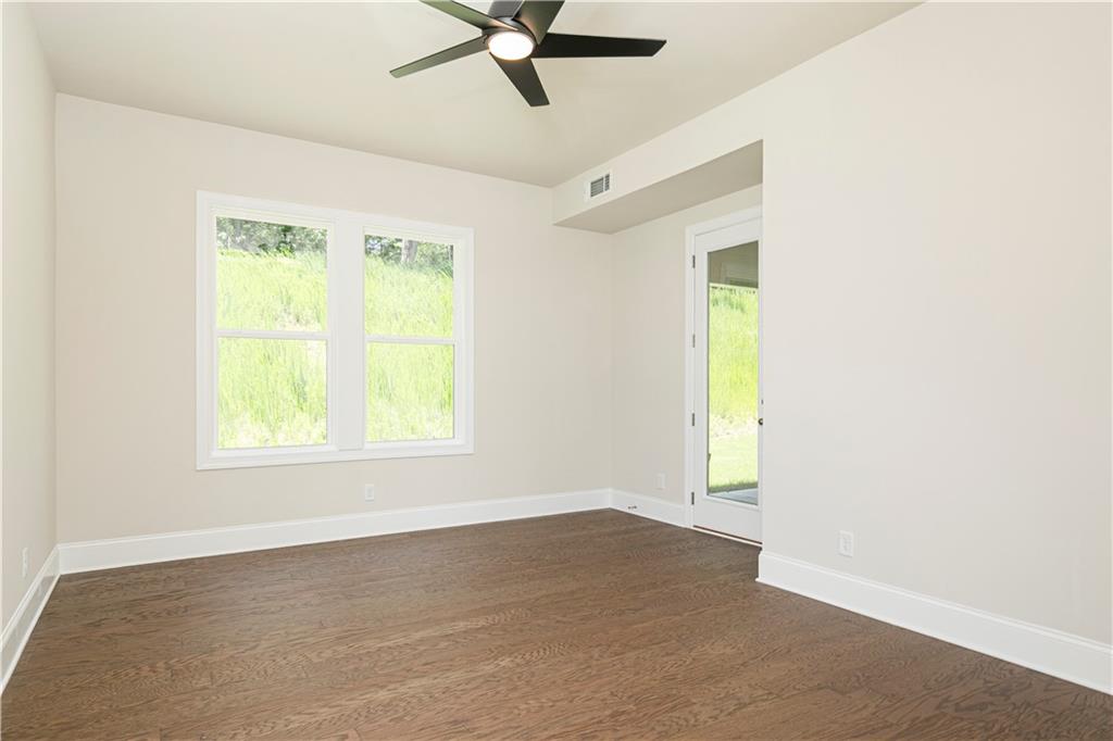 2475 Stewart Road Cumming, GA 30041 - Photo 16 of 30 an empty room with a window and a ceiling fan