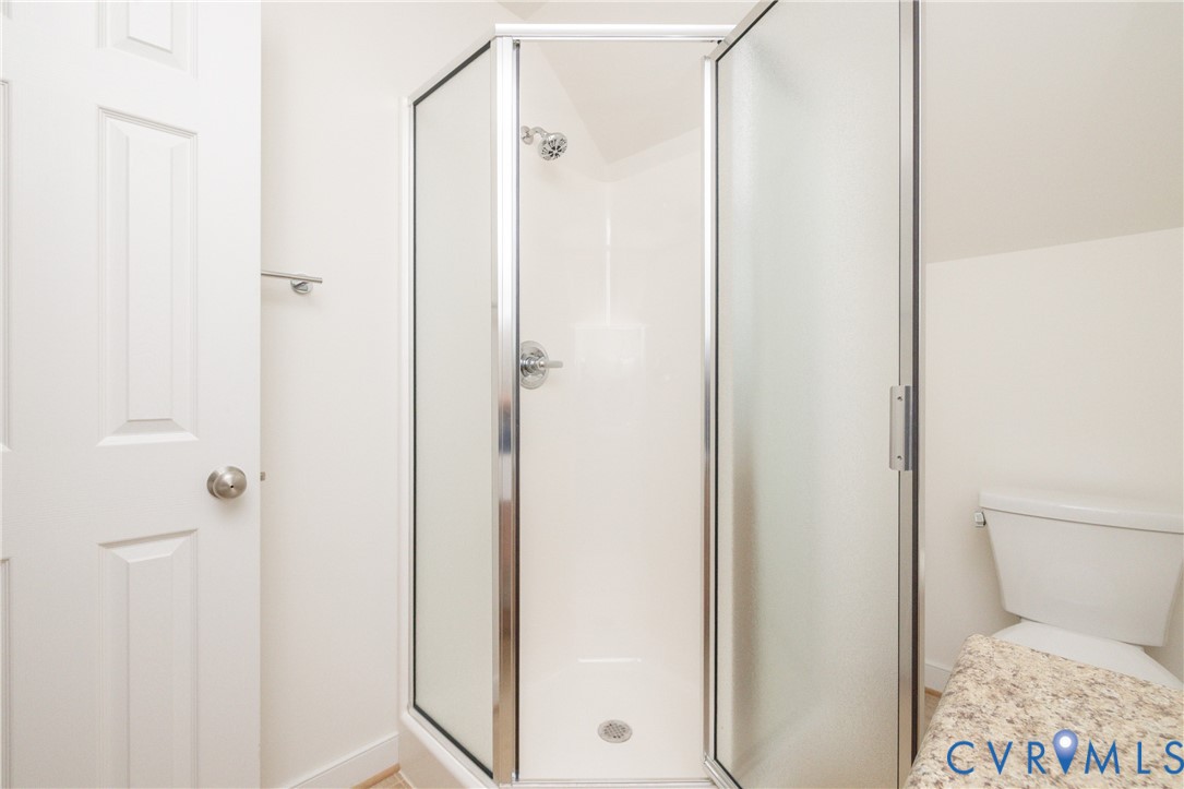 15618 Rowlett Road Chesterfield, VA 23838 - Photo 21 of 29 a bathroom with a shower and a toilet