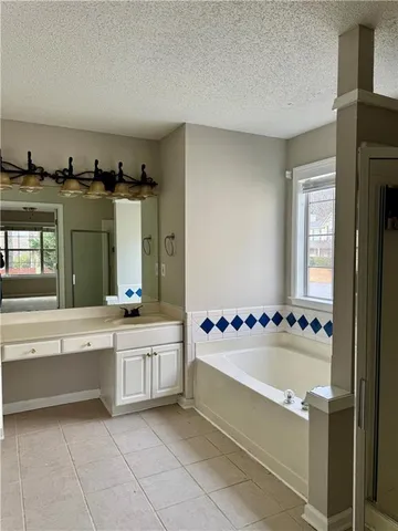 a bathroom with a bathtub and a sink