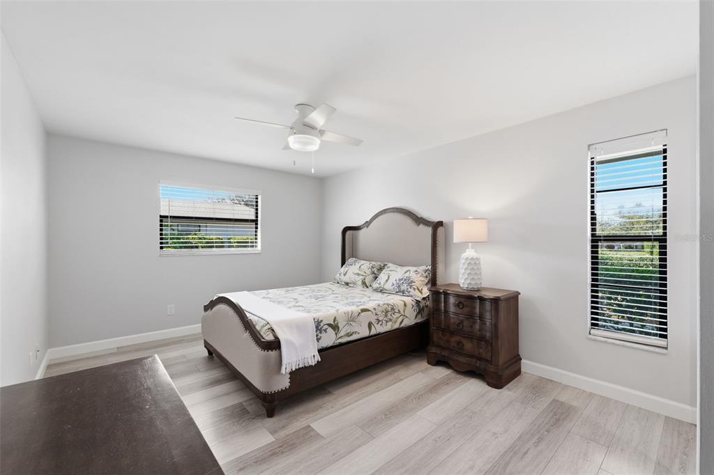 9204 Golf View Drive New Port Richey, FL 34655 - Photo 13 of 39 a bedroom with a bed lamp and a window