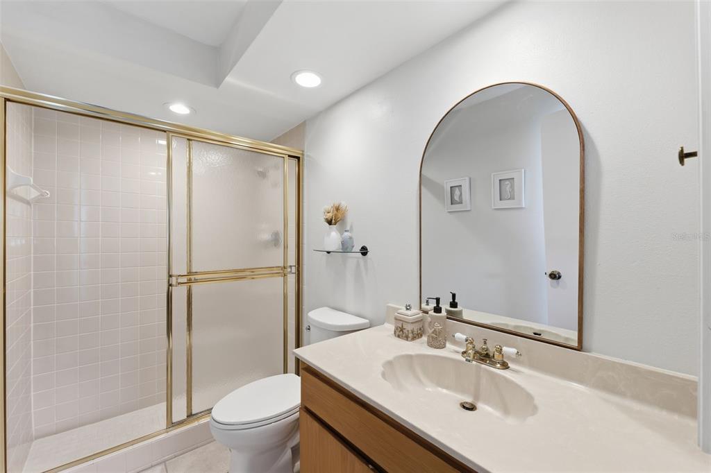 9204 Golf View Drive New Port Richey, FL 34655 - Photo 15 of 39 a bathroom with a sink toilet and shower