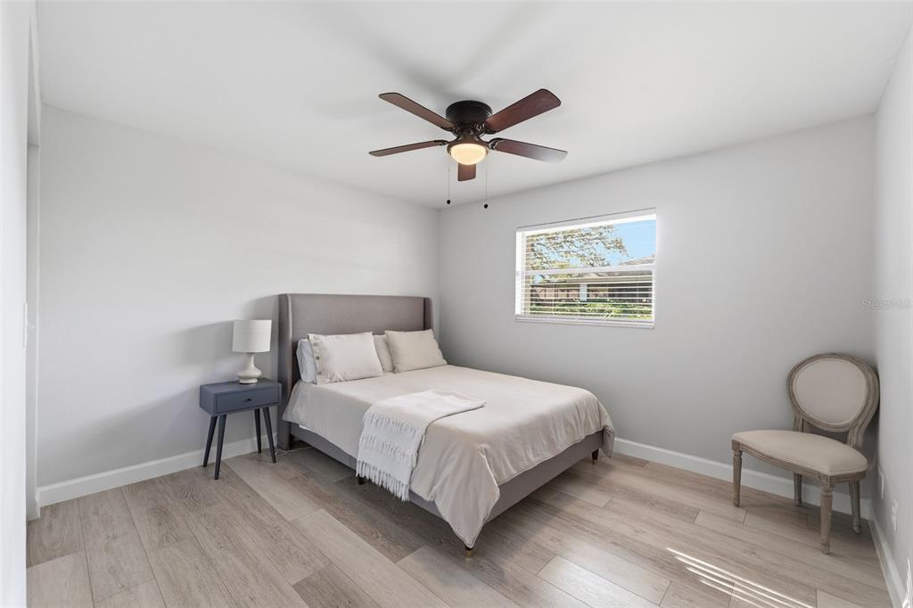 9204 Golf View Drive New Port Richey, FL 34655 - Photo 17 of 39 a bedroom with a bed and a window