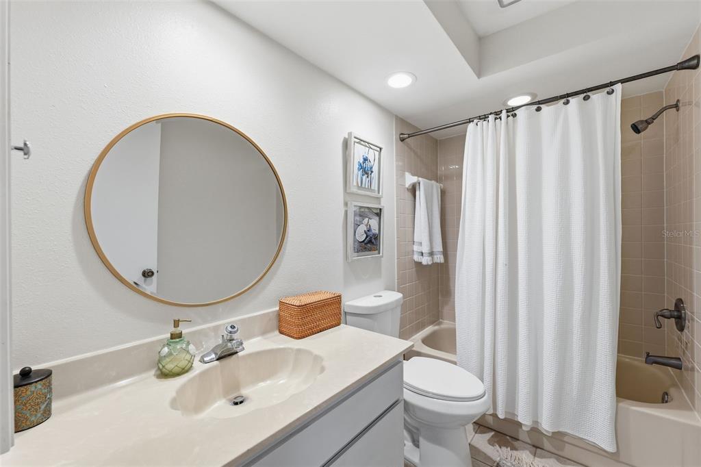 9204 Golf View Drive New Port Richey, FL 34655 - Photo 19 of 39 a bathroom with a sink toilet and shower