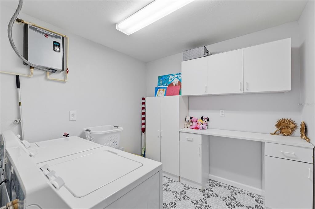 9204 Golf View Drive New Port Richey, FL 34655 - Photo 20 of 39 a room with storage and utility