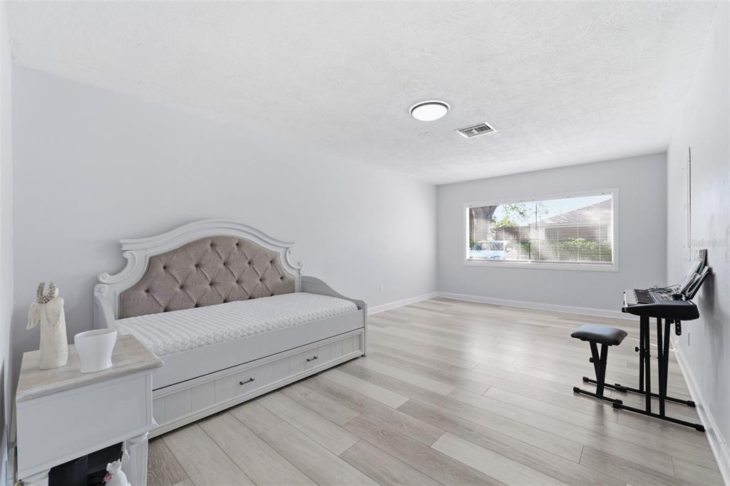 9204 Golf View Drive New Port Richey, FL 34655 - Photo 21 of 39 a living room with furniture and a window