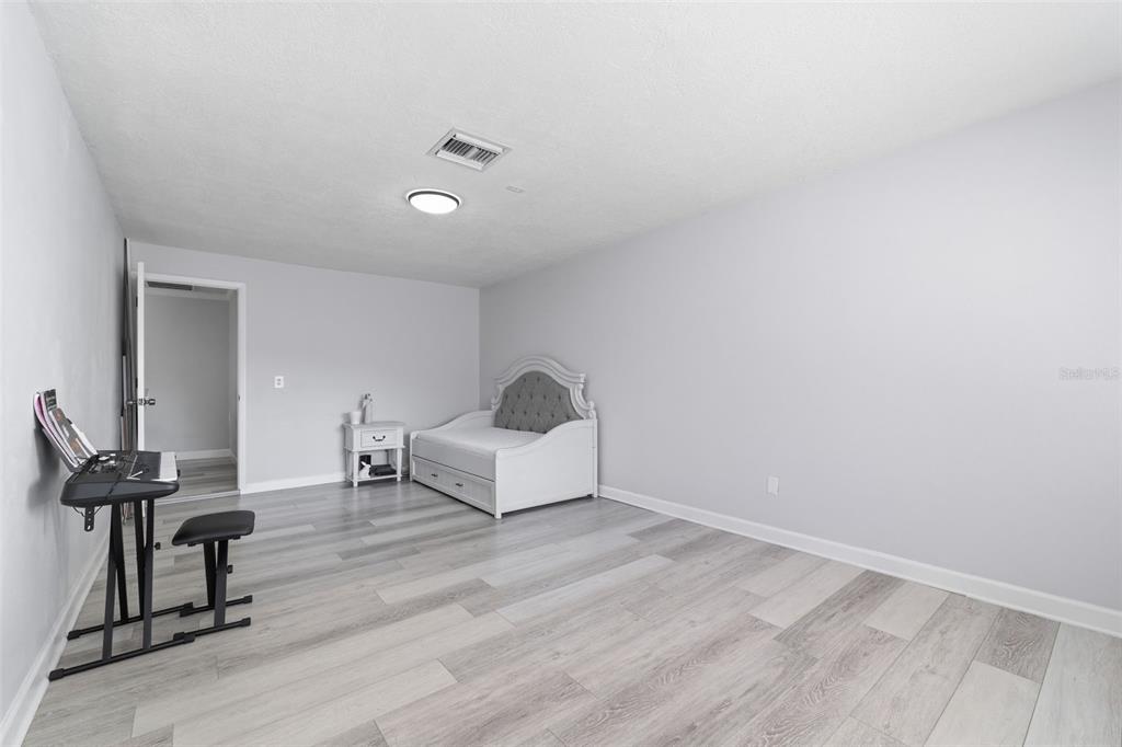 9204 Golf View Drive New Port Richey, FL 34655 - Photo 22 of 39 a room with furniture and a window