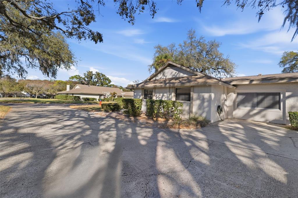 9204 Golf View Drive New Port Richey, FL 34655 - Photo 26 of 39 a view of a house with a yard
