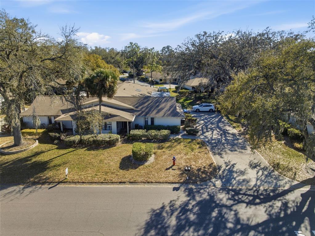 9204 Golf View Drive New Port Richey, FL 34655 - Photo 28 of 39 a view of a house with a yard covered in snow