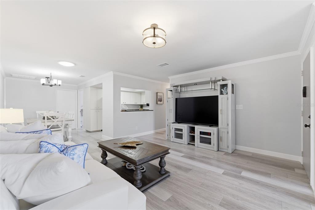 9204 Golf View Drive New Port Richey, FL 34655 - Photo 5 of 39 a living room with furniture and a flat screen tv