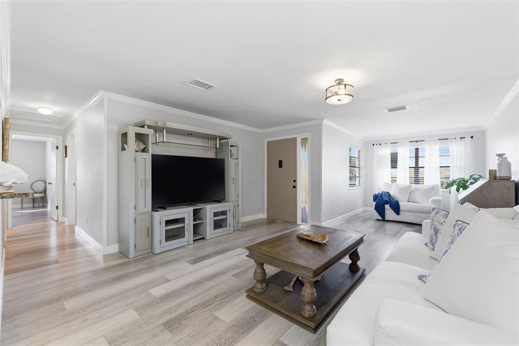 9204 Golf View Drive New Port Richey, FL 34655 - Photo 6 of 39 a living room with furniture and a flat screen tv