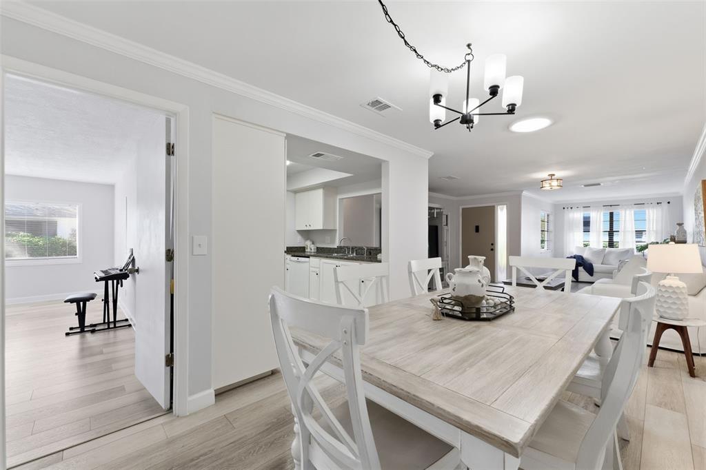 9204 Golf View Drive New Port Richey, FL 34655 - Photo 9 of 39 a view of a dining room with furniture and wooden floor