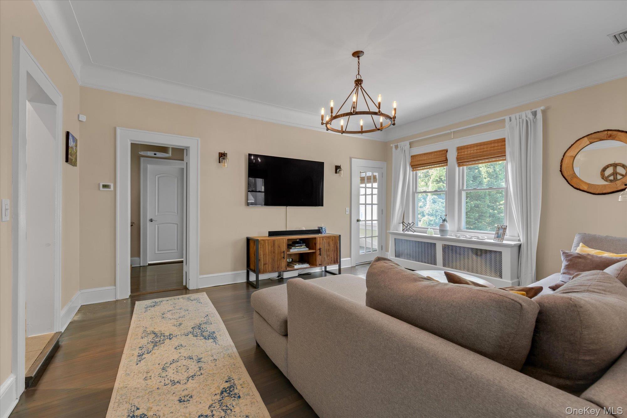 80 Skunks Misery Road Locust Valley, NY 11560 - Photo 10 of 25 a living room with furniture and a flat screen tv