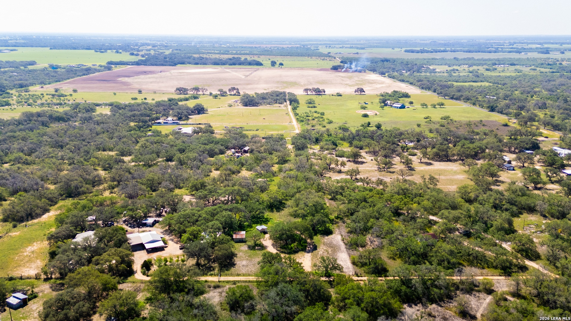 230 P R D65 Poteet, TX 78065 - Photo 27 of 29 an aerial view of residential building and lake view