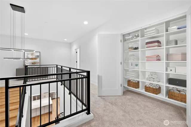 a view of an empty room with stairs