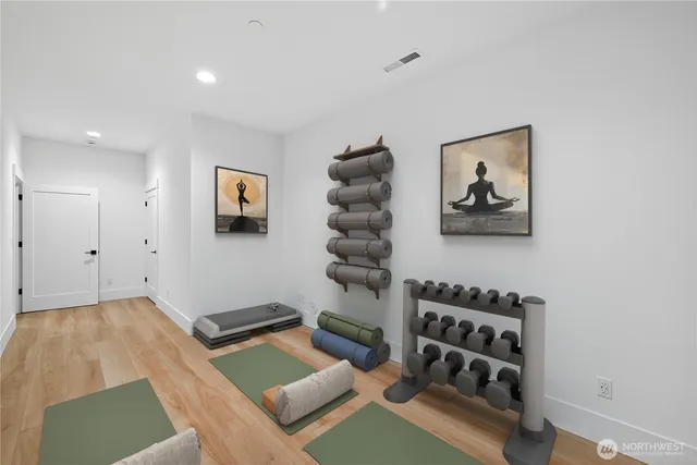 a living room with furniture a couch and a wall painting