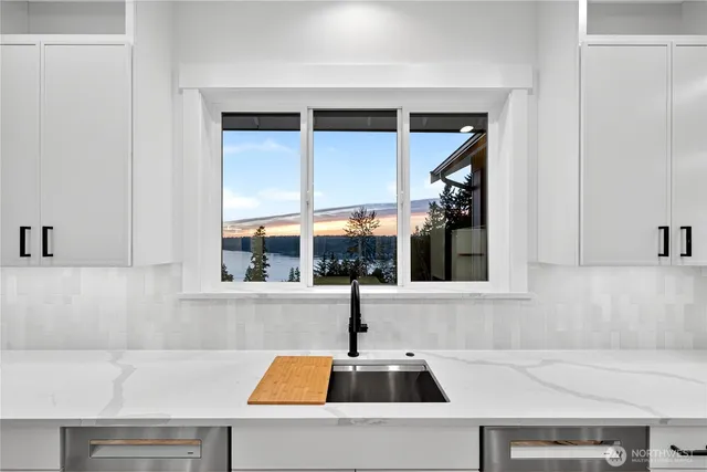 a kitchen with a sink and a window