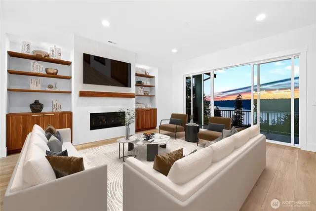 a living room with furniture a fireplace and a flat screen tv