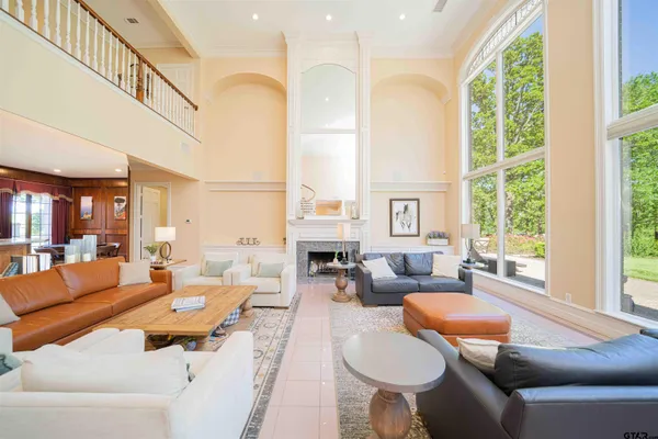 a view of staircase with furniture and a floor to ceiling window