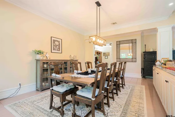 a kitchen with granite countertop a sink cabinets and wooden floor
