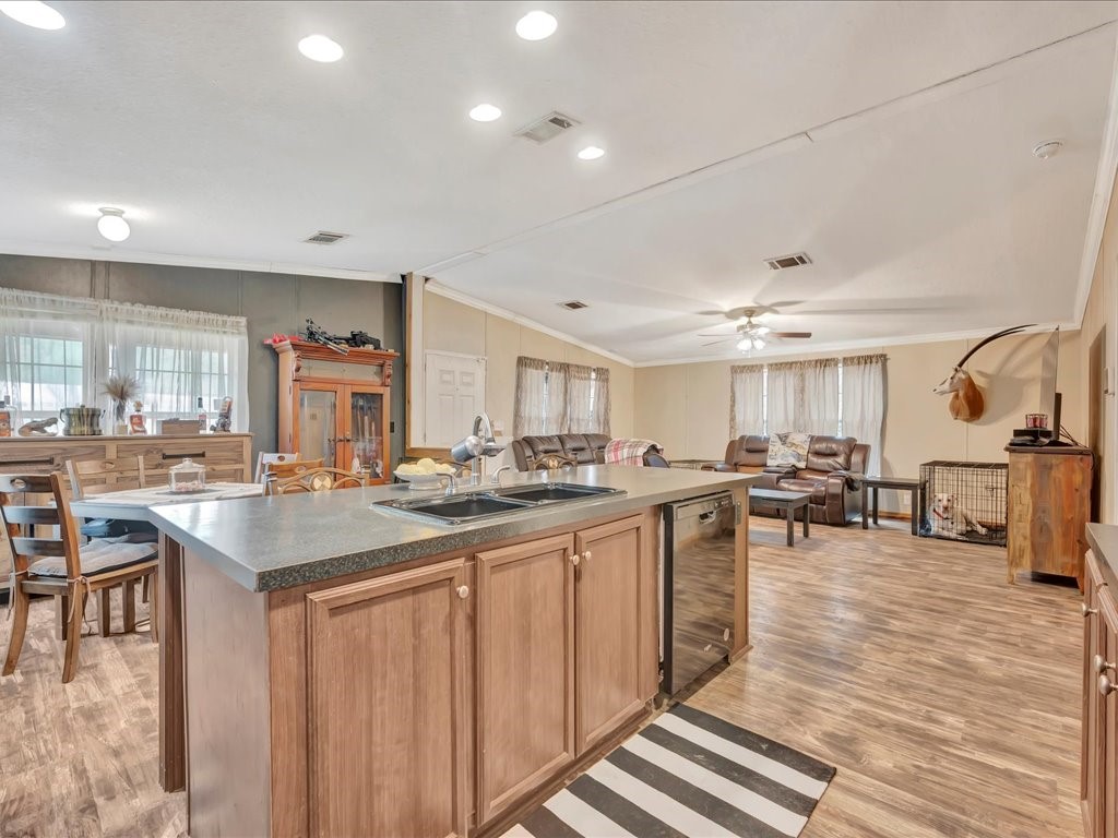 412 Ridge Trail Trinity, TX 75862 - Photo 11 of 39 a kitchen with lots of counter top space and painting on the wall