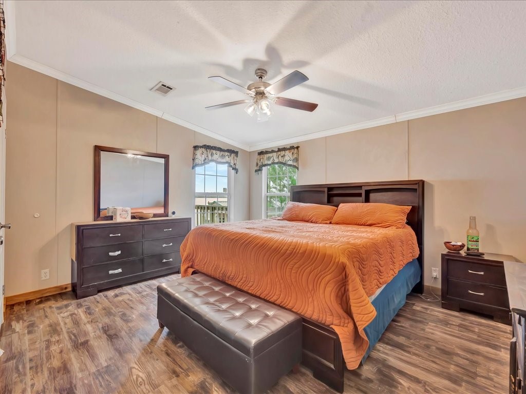 412 Ridge Trail Trinity, TX 75862 - Photo 19 of 39 a bedroom with a bed and a dresser