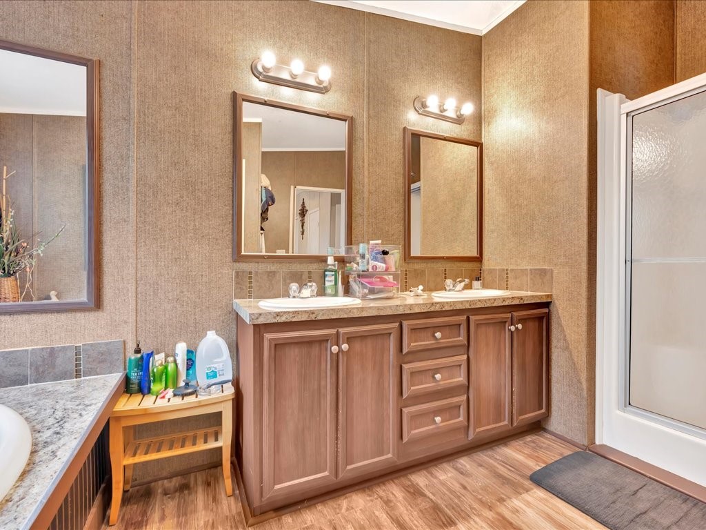 412 Ridge Trail Trinity, TX 75862 - Photo 21 of 39 a spacious bathroom with a granite countertop sink and a mirror