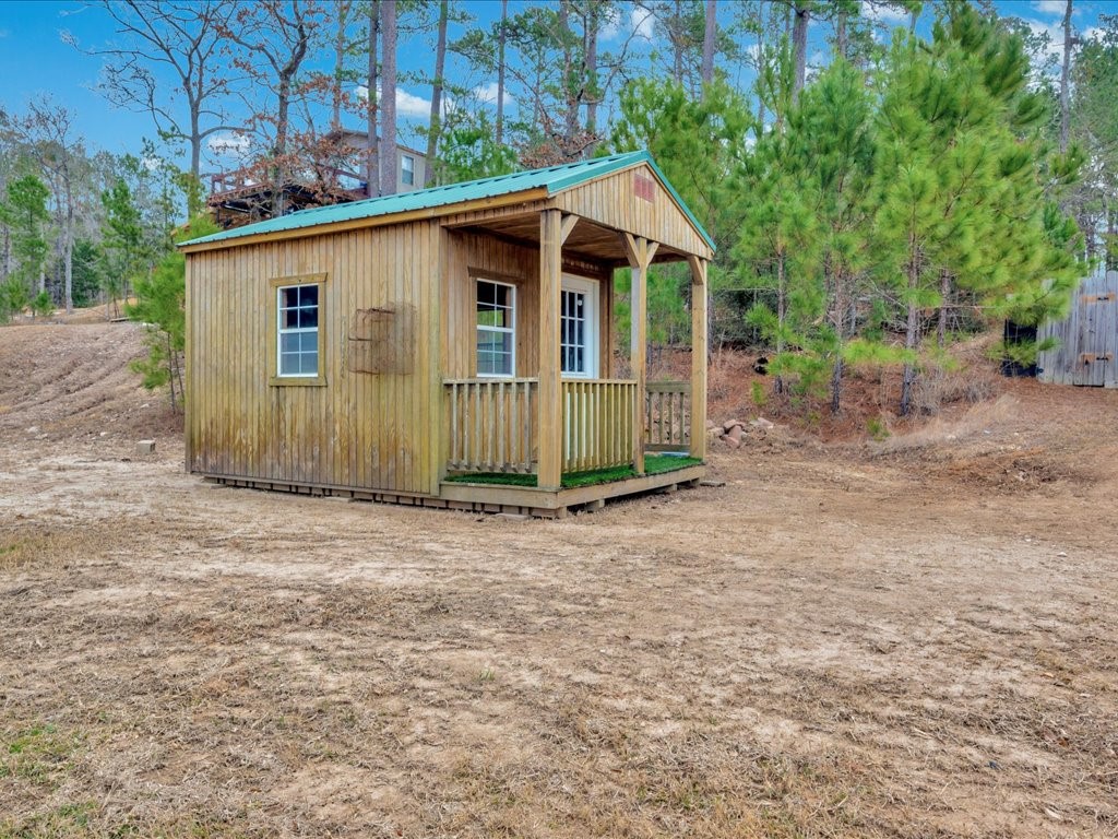 412 Ridge Trail Trinity, TX 75862 - Photo 29 of 39 a view of a house with a yard and large trees