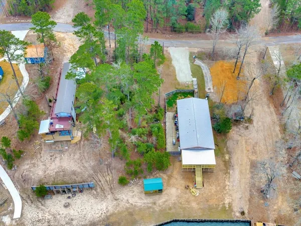 an aerial view of residential house with outdoor space