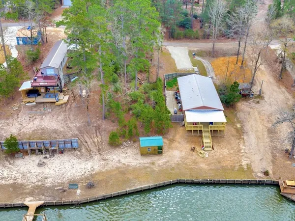 an aerial view of a house with outdoor space