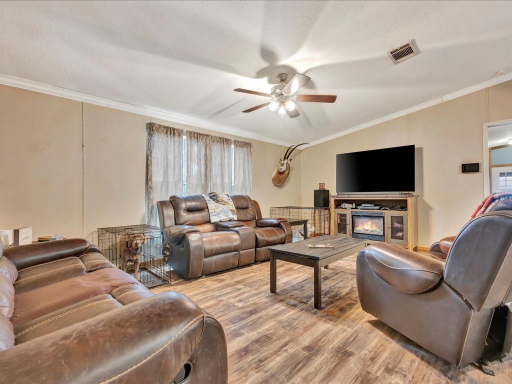 412 Ridge Trail Trinity, TX 75862 - Photo 6 of 39 a living room with furniture and a flat screen tv