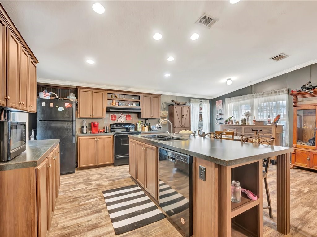 412 Ridge Trail Trinity, TX 75862 - Photo 9 of 39 a kitchen with stainless steel appliances granite countertop a sink counter space cabinets and a counter top space
