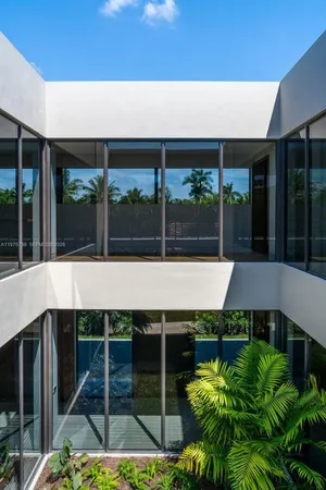 a view of a balcony with yard