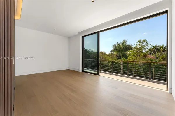 wooden floor in an empty room with glass door