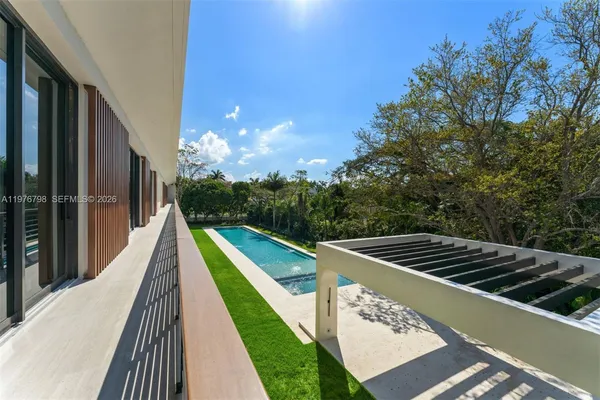 a view of a swimming pool with deck and outdoor space