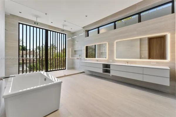 a bathroom with a bathtub and a window