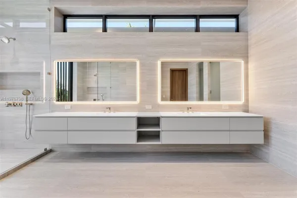 a bathroom with sink and mirror